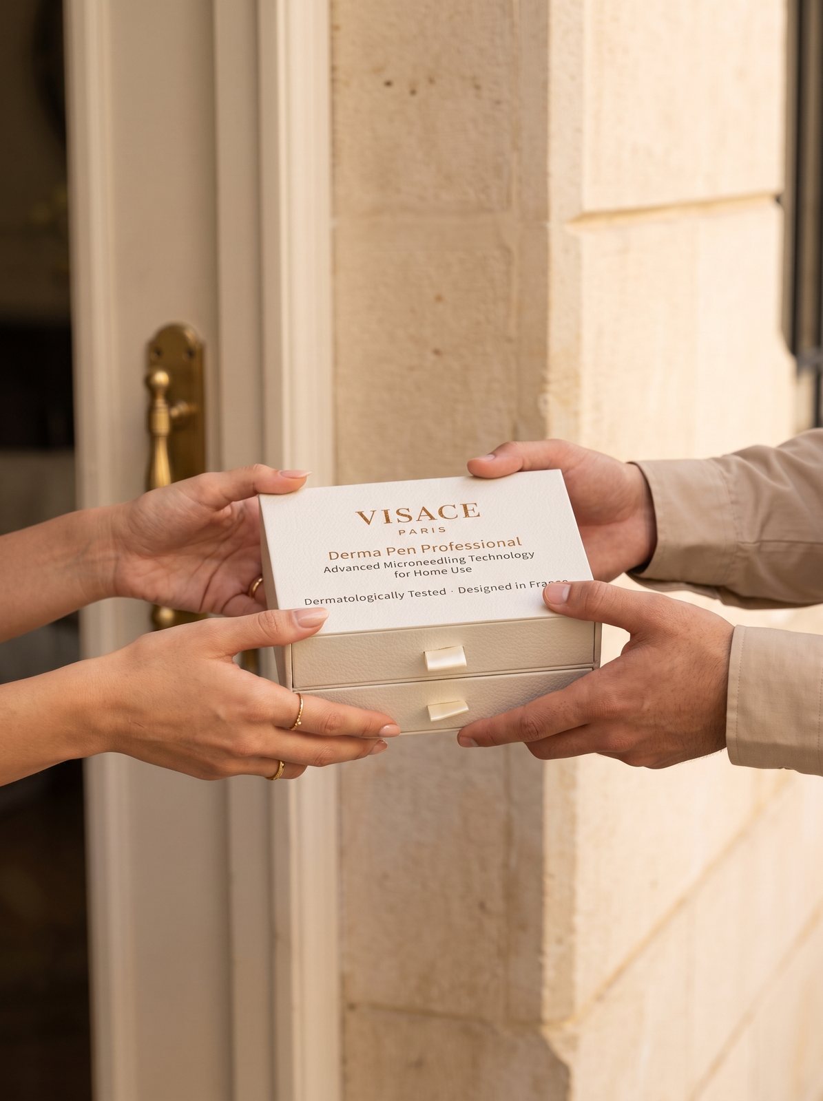 A courier handing the cream VISACE gift box to a woman at her front door